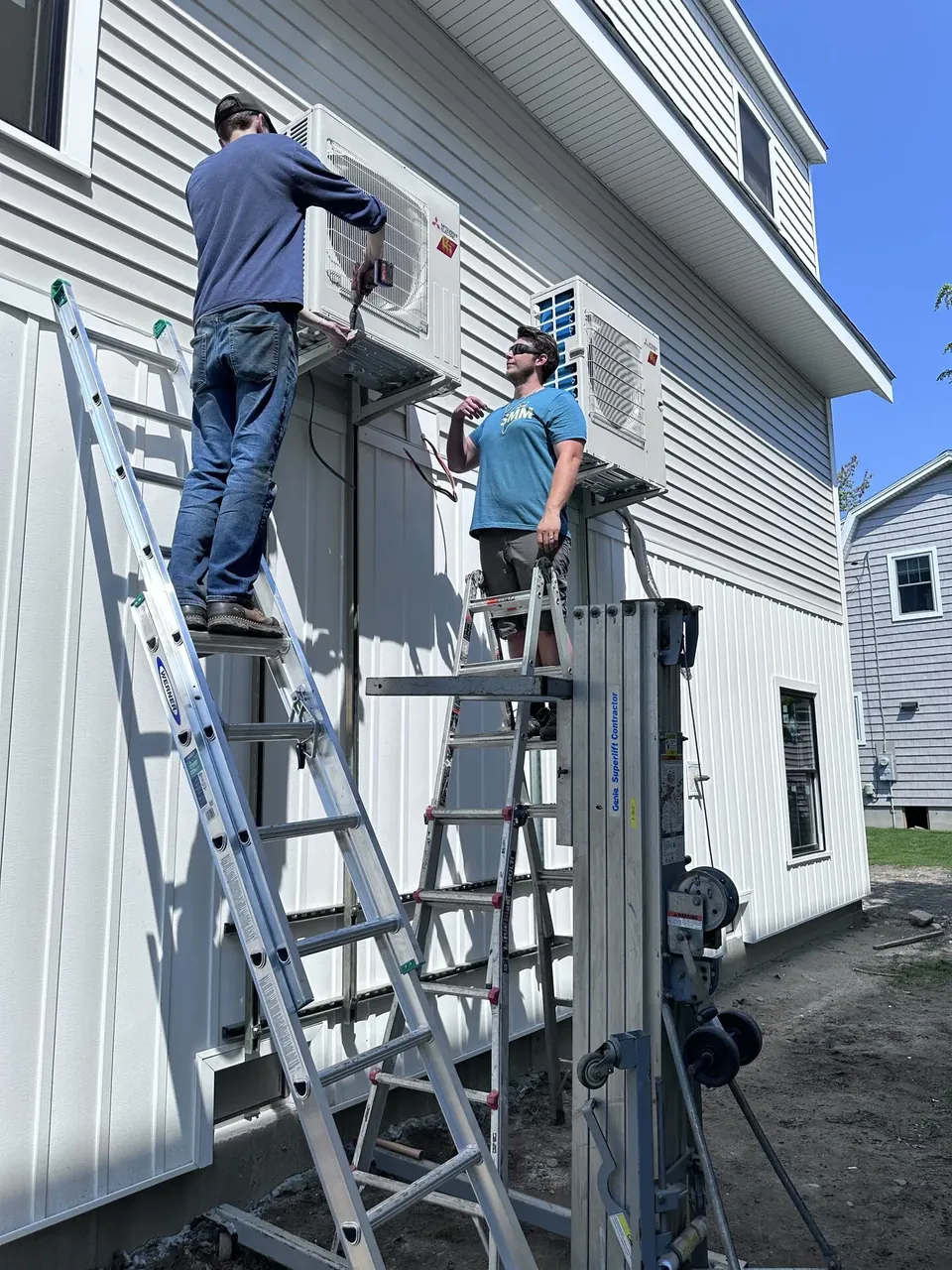 Southern Maine Mechanical technician installing a Mitsubishi ductless mini-split on a Southern Maine home