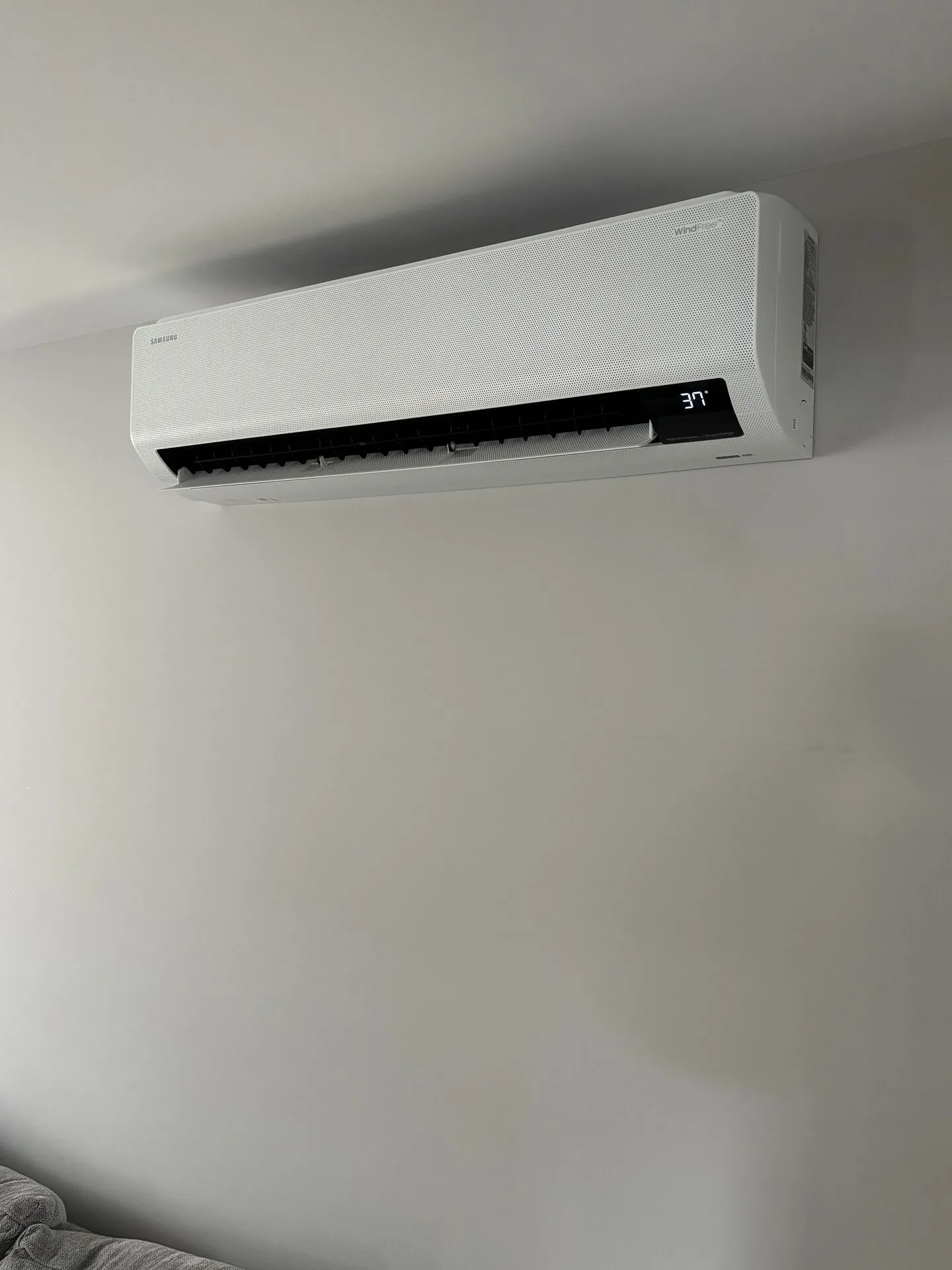 Samsung WindFree wall-mounted mini-split indoor head installed in a Southern Maine bedroom