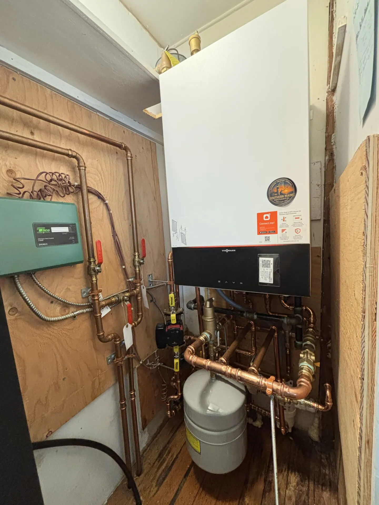 Viessmann wall-mounted boiler with copper piping and expansion tank installed by Southern Maine Mechanical