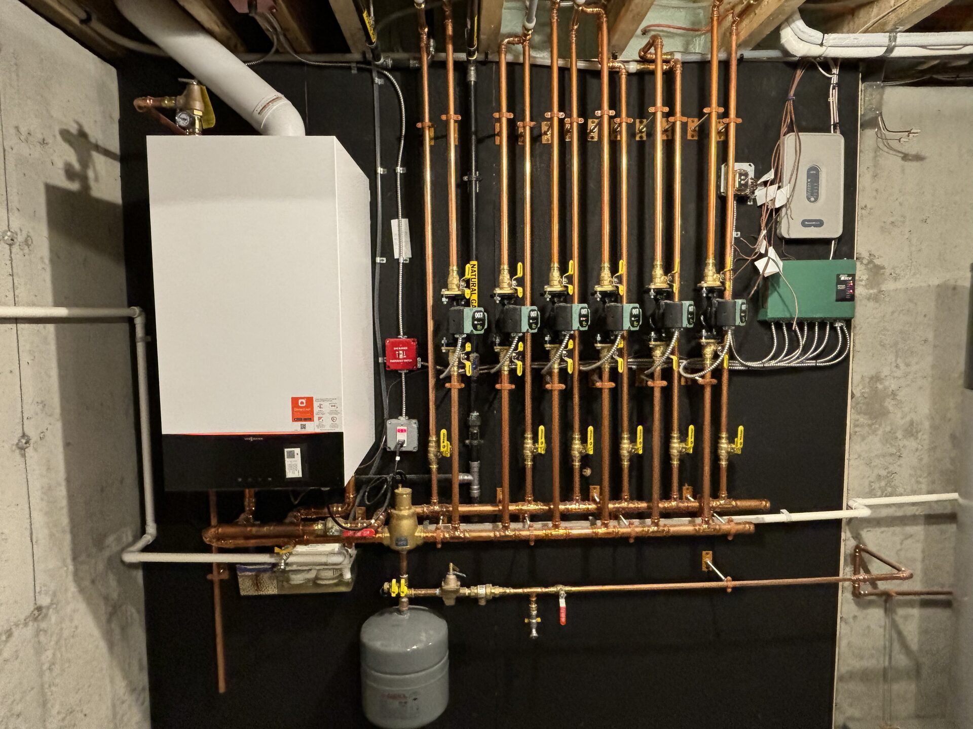New hydronic heating system with copper zone manifold installed in Maine home